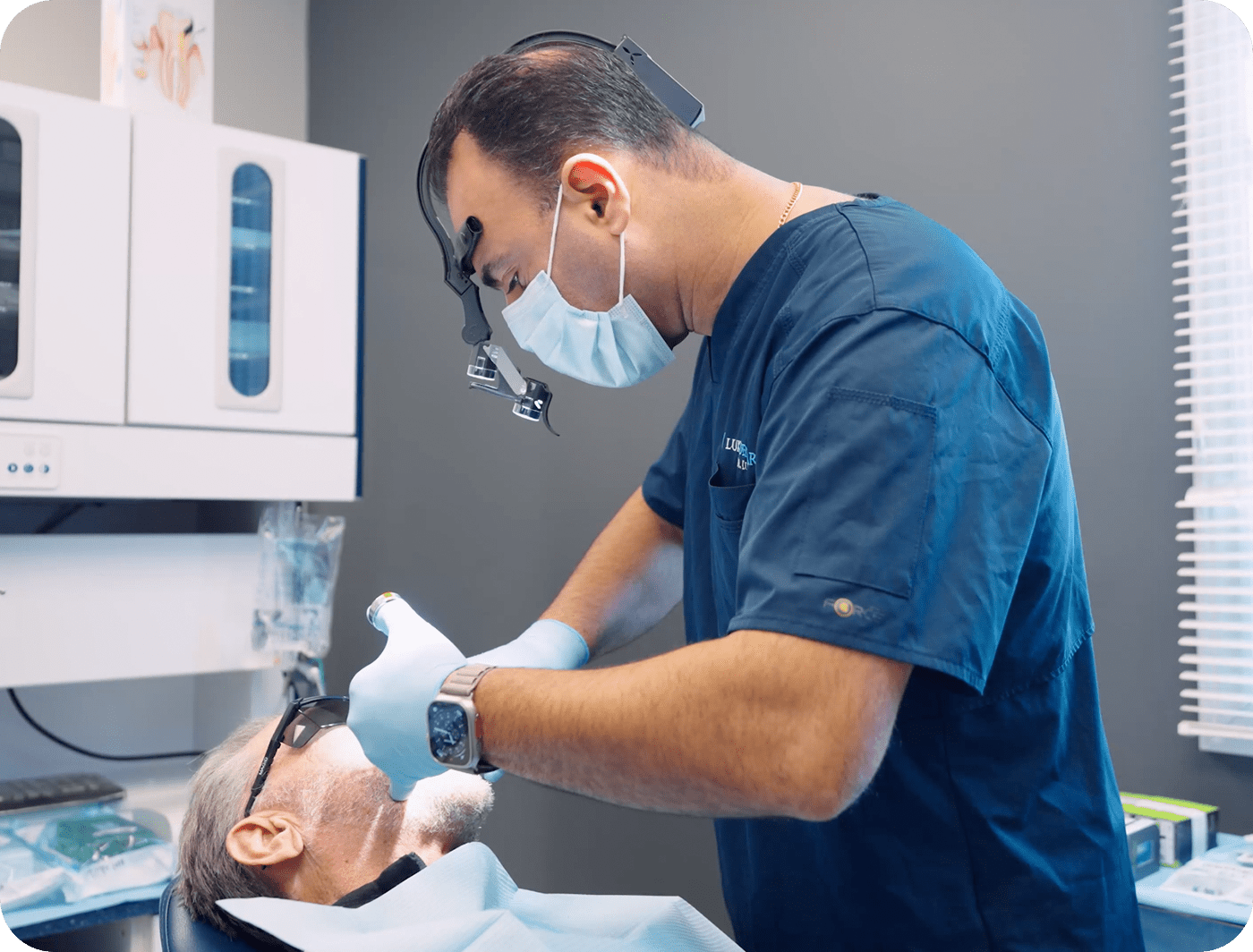 Dr Rand Luka placing dental implants
